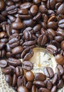 Watch in the lots of natural coffee beans Royalty Free Stock Photo