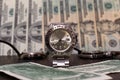 Watch in metal case on dollars Royalty Free Stock Photo