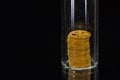 Watch Repair: Close Look at a Tower of Watch Gears Under Glass Vial