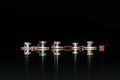 Watch Repair: Five Roller Tables and Roller Jewels Against a Black Background