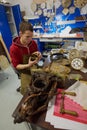 Watch restoration workshop of the state hermitage. Restorer at work repairs gears, watchmaker tools on the table