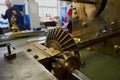 Watch restoration workshop of the state hermitage. Restorer at work repairs gears, watchmaker tools on the table