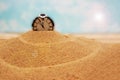 Watch in the sand. concept of time planning, deadlines