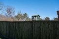 Watch tower behind concrete wall with barbed wire. Abandoned communist prison in eastern Europe Royalty Free Stock Photo