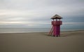 Watch tower on empty sand beach by sea at dawn sky, minimalistic landscape, Montenegro, Ulcinj, Long beach Royalty Free Stock Photo