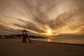 Watch tower on empty sand beach by the sea at sunset, Montenegro, Ulcinj,.Long beach