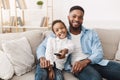 Watch Tv Together. Father And Daughter Switch Channels