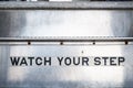 Watch your step sign on stairs Royalty Free Stock Photo