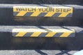 Watch your Step sign on stairs Royalty Free Stock Photo