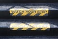 Watch your Step sign on stairs Royalty Free Stock Photo