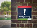 Watch Your Walk: 'Mind Your Step' Safety Sign Royalty Free Stock Photo