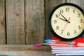 Watches and school tools. On wooden background. Royalty Free Stock Photo