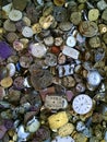 Discarded watches jumbled in a pile