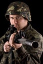 Watchful soldier aiming m16 in studio Royalty Free Stock Photo