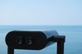 Watching the Black Sea through a binocular telescope. Travel and tourism. Coin binoculars