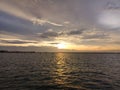 Watching the sun set down to the peaceful ocean of the straights of Melacca at the north port of Klang Royalty Free Stock Photo