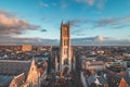 Watching the sunset over Ghent from the historic tower in the city centre. Romantic colours in the sky. Red light illuminating Royalty Free Stock Photo