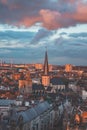 Watching the sunset over Ghent from the historic tower in the city centre. Romantic colours in the sky. Red light illuminating Royalty Free Stock Photo