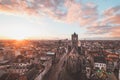 Watching the sunset over Ghent from the historic tower in the city centre. Romantic colours in the sky. Red light illuminating Royalty Free Stock Photo