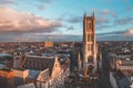 Watching the sunset over Ghent from the historic tower in the city centre. Romantic colours in the sky. Red light illuminating Royalty Free Stock Photo