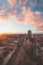 Watching the sunset over Ghent from the historic tower in the city centre. Romantic colours in the sky. Red light illuminating Royalty Free Stock Photo