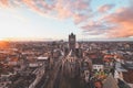 Watching the sunset over Ghent from the historic tower in the city centre. Romantic colours in the sky. Red light illuminating Royalty Free Stock Photo