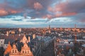 Watching the sunset over Ghent from the historic tower in the city centre. Romantic colours in the sky. Red light illuminating Royalty Free Stock Photo