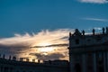Rome - Scenic sunset view from St Peter square in the Vatican City, Rome, Italy. Silhouette of statues Royalty Free Stock Photo