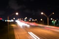 Watching transport moving in street. Urban traffic. Blurred car lights night. Urban night. Lights defocused background Royalty Free Stock Photo