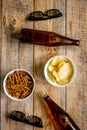 Watching TV with chips, beer and glasses on wooden background to