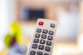 Watching TV in the living room. Relax. Technologies. Watching TV and using remote controller. Royalty Free Stock Photo