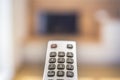 Watching TV in the living room. Relax. Technologies. Watching TV and using remote controller Royalty Free Stock Photo