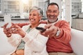 Watching tv, phone and happy couple in home living room, bonding and having fun. Cellphone, television and elderly man Royalty Free Stock Photo