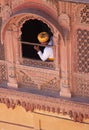 Watching from an upper window of an Indian fort