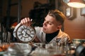 Watchmaker adjusts the mechanism of old watches