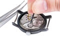 Watchmaker repairs old watch on white Royalty Free Stock Photo