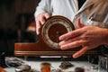 Watchmaker restore old wooden table clock