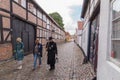 Watchman in old narrow street in Ribe, Denmark Royalty Free Stock Photo