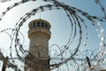 watchtower with barbed wire fence, security theme. Royalty Free Stock Photo