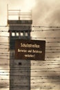 Watchtower with barbed wire and prohibition sign in East Germany Royalty Free Stock Photo