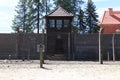 Watchtower and barbed wires fence of concentration camp Auschwitz