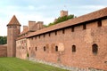 Watchtower and brick buildings on the territory of the chivalrous castle of the Teutonic Order. Marlbork, Poland Royalty Free Stock Photo