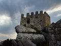 Watchtower and defensive wall in the Medieval Castelo dos Mouros aka Castle of the Moors in Sintra, Portugal. Royalty Free Stock Photo