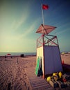 Watchtower for lifeguards and the red flag with vintage effect