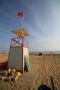 watchtower for lifeguards and the red flag Royalty Free Stock Photo