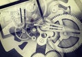 Watchwork wheels with drawing stuff and tablet Royalty Free Stock Photo