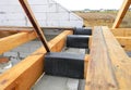 Wateproofing house roof wooden beams, trusses with bitumen material. House roofing construction