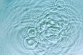 Water abstract background with blue rippled aqua texture, splash circle reflections in swimming pool. Top view Royalty Free Stock Photo