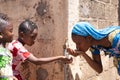 Water for African Children drinking fresh water outdoors Royalty Free Stock Photo