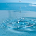 Water against a blue background emphasizes the droplets as they Royalty Free Stock Photo